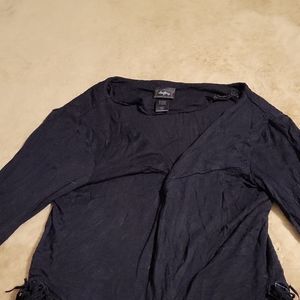 A small black cardigan with fringe